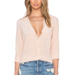 100% silk Dry clean only Button front closure Front patch pocket Buttoned sleeve